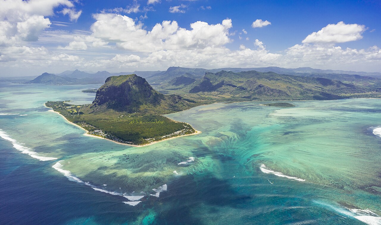 An aerial view of the underwater waterfall and Le Morne peninsula